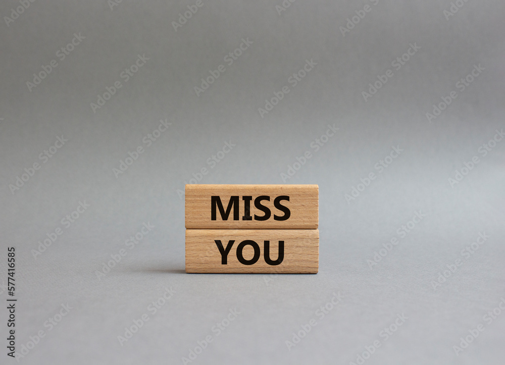 Miss you. Concept word Miss you on wooden cubes. Beautiful grey background. Business and Miss you concept. Copy space. Miss you. Concept word Miss you on wooden cubes. Beautiful grey background. Business and Miss you concept. Copy space.