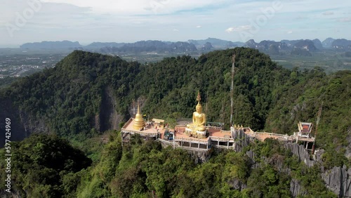 Wallpaper Mural Orbital aerial footage of Tiger Cave Temple viewpoint on sunny day. Krabi, Thailand. Torontodigital.ca