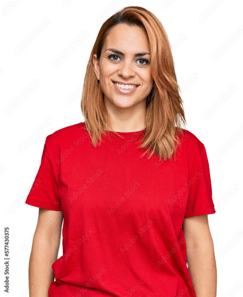 Hispanic young woman wearing casual red t shirt with a happy and cool smile on face. lucky person. Hispanic young woman wearing casual red t shirt with a happy and cool smile on face. lucky person.
