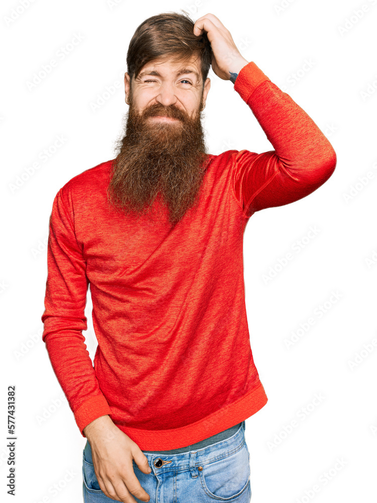 Redhead man with long beard wearing casual clothes confuse and wonder about question. uncertain with doubt, thinking with hand on head. pensive concept. Redhead man with long beard wearing casual clothes confuse and wonder about question. uncertain with doubt, thinking with hand on head. pensive concept.