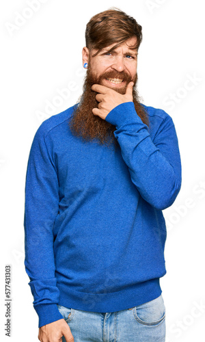 Young irish redhead man wearing casual clothes looking confident at the camera smiling with crossed arms and hand raised on chin. thinking positive.