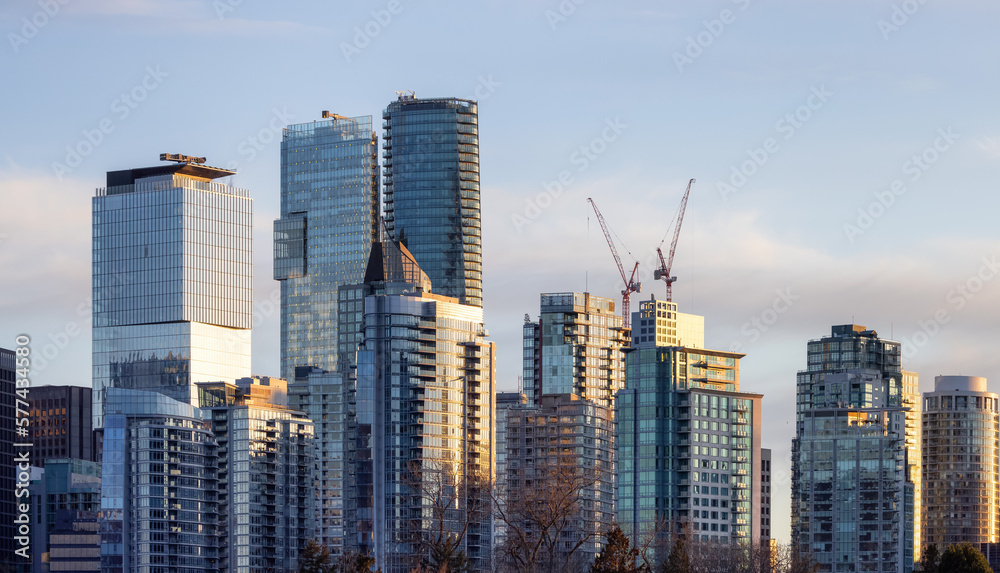 Obraz premium Highrise Residential and Commercial Buildings in Modern Downtown City. Vancouver, British Columbia, Canada. Winter Sunset.