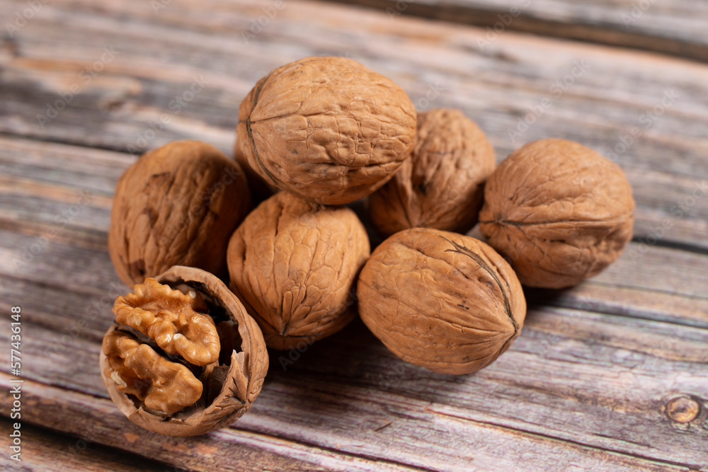 walnuts on wooden table walnuts on wooden table