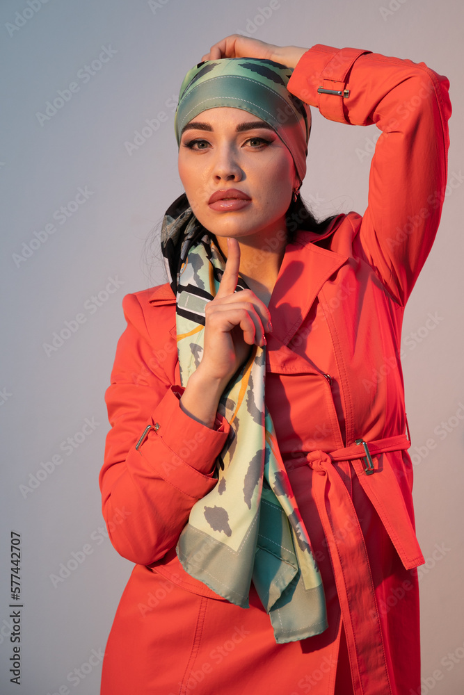 portrait of a woman in an orange dress and a headscarf portrait of a woman in an orange dress and a headscarf