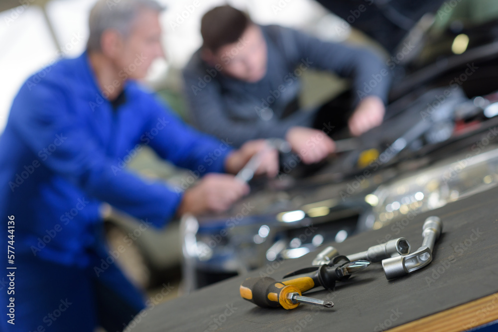 Fototapeta premium concept of garage work apprentice