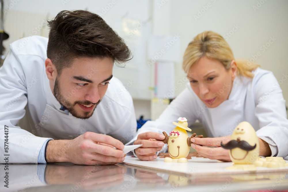 chocolatier artisan decorating easter eggs