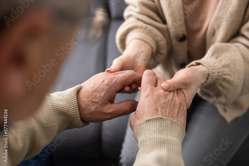 Canvastavla Two people holding hand together. elderly man and support woman
