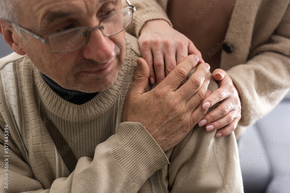 Two people holding hand together. elderly man and support woman