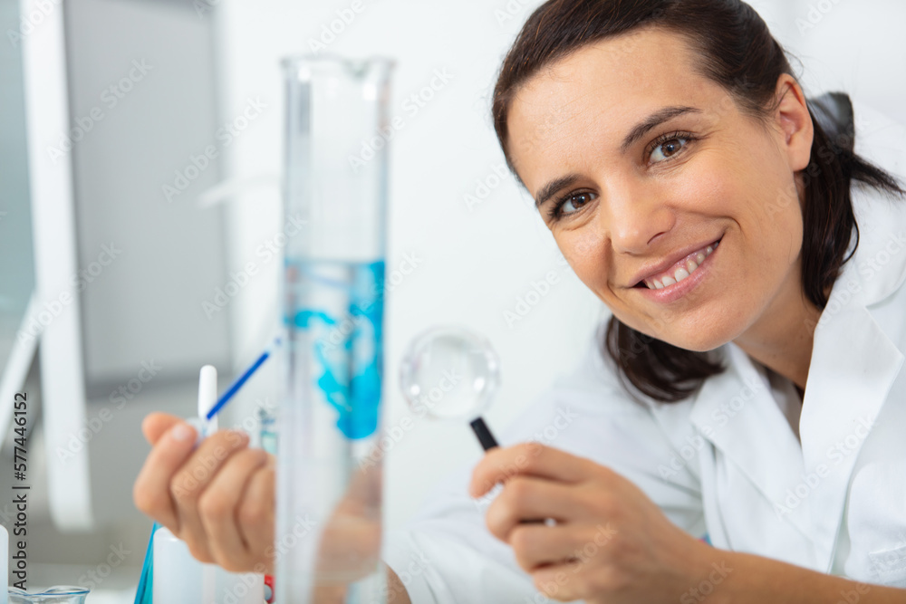 one female laboratory scientist working at lab with test tubes one female laboratory scientist working at lab with test tubes