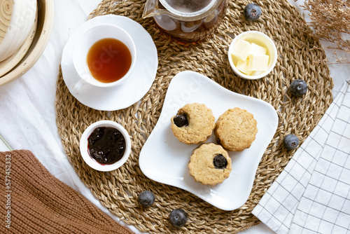 Delicious blueberry Scones on white cafe table.