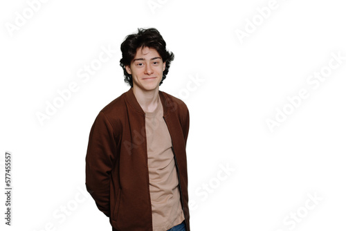 Young handsome caucasian boy in casual standing against transparent background. Cheerful Italian brunet guy looks at camera. Mockup, happy people. Satisfied student entered university. Education. photo