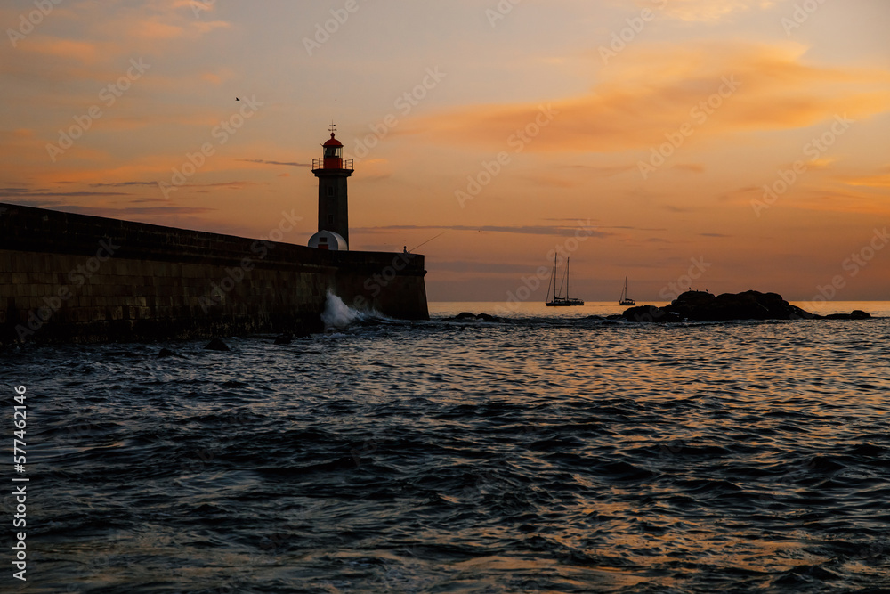 Ocean lighthouse at the sunset. Ocean lighthouse at the sunset.