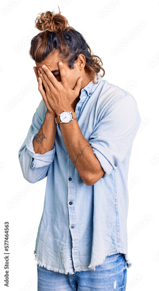 Young hispanic man wearing summer style with sad expression covering face with hands while crying. depression concept. Young hispanic man wearing summer style with sad expression covering face with hands while crying. depression concept.