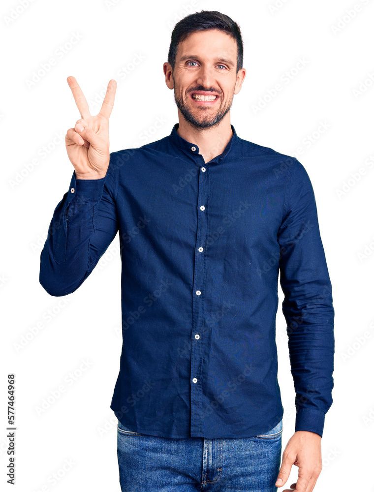 Young handsome man wearing casual shirt showing and pointing up with fingers number two while smiling confident and happy. Young handsome man wearing casual shirt showing and pointing up with fingers number two while smiling confident and happy.