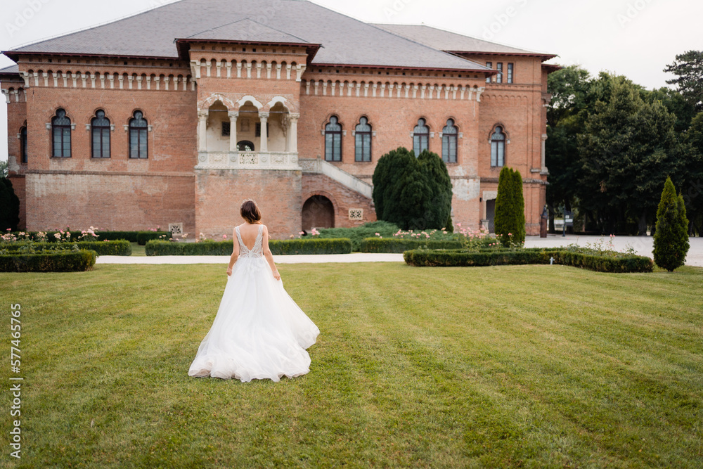 Fototapeta premium bride and groom walking in the park