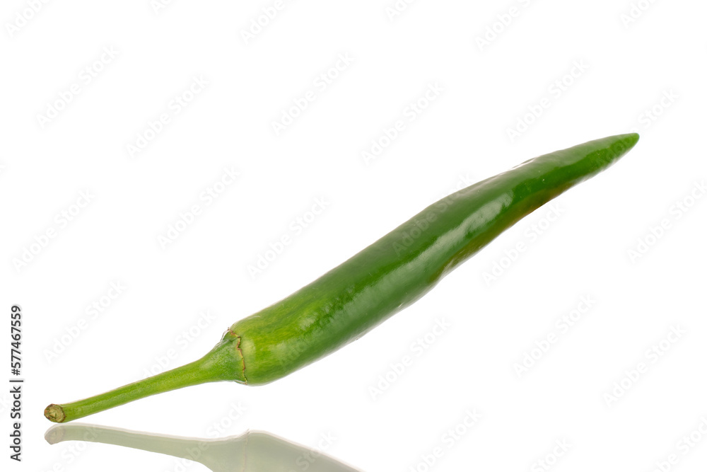 One green spicy pepper, macro, isolated on a white background. One green spicy pepper, macro, isolated on a white background.