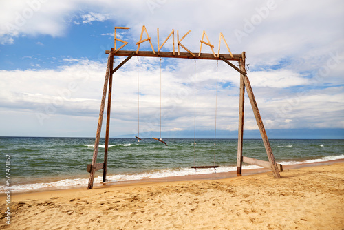 Wooden swing on the beach of Lake Baikal. Barguzin Bay. The Republic of Buryatia.  © Viktoriya