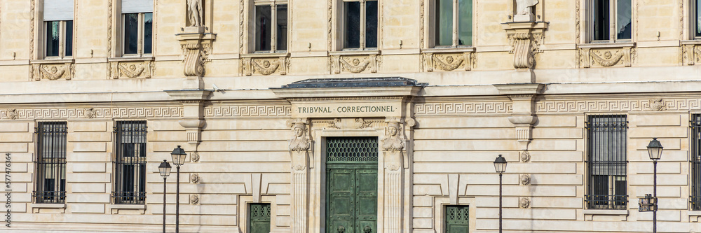 Entrance door and name engraved on the former Paris Criminal Court building on the Quai des Orfevres in Paris, France