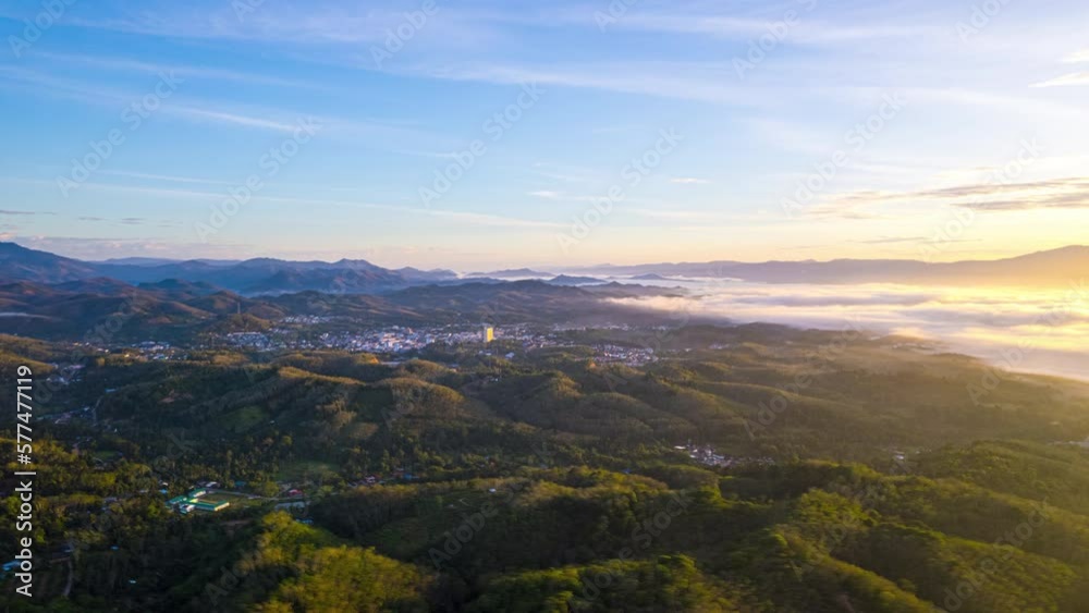 Aerial fly drone hyperlapse foggy or the clouds while sunrise sky on the city, sea of mist mount nature. Aerial fly drone hyperlapse foggy or the clouds while sunrise sky on the city, sea of mist mount nature.