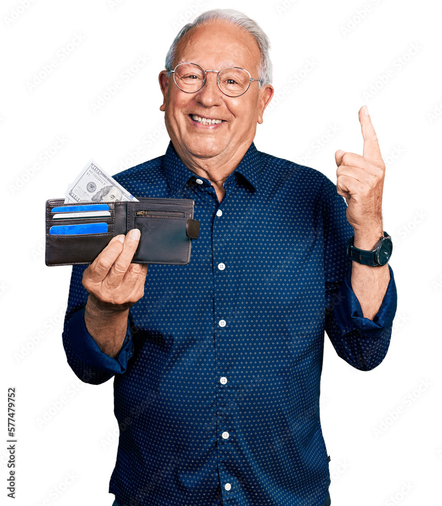Senior man with grey hair holding leather wallet smiling with an idea or question pointing finger with happy face, number one Senior man with grey hair holding leather wallet smiling with an idea or question pointing finger with happy face, number one