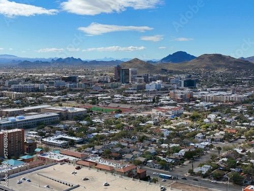 Tucson downtown modern skyscrapers aerial view with Tucson Mountain at the background in city of Tucson, Arizona AZ, USA.  photo