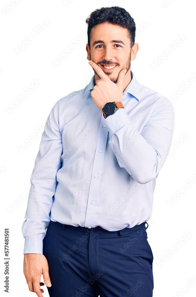 Young hispanic man wearing business clothes looking confident at the camera smiling with crossed arms and hand raised on chin. thinking positive. Young hispanic man wearing business clothes looking confident at the camera smiling with crossed arms and hand raised on chin. thinking positive.