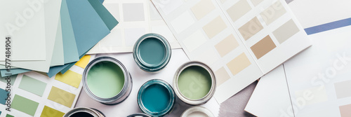 Tableau sur toile Tiny sample paint cans during house renovation, process of choosing paint for th