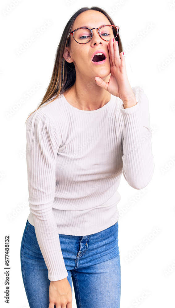 Beautiful brunette young woman wearing casual white sweater and glasses hand on mouth telling secret rumor, whispering malicious talk conversation Beautiful brunette young woman wearing casual white sweater and glasses hand on mouth telling secret rumor, whispering malicious talk conversation