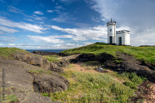 Elie Ness Lighthouse stands on an outcrop of rocks on the Firth of Forth, Scotland
