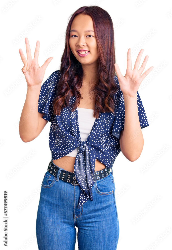 Young beautiful chinese girl wearing casual clothes showing and pointing up with fingers number nine while smiling confident and happy. Young beautiful chinese girl wearing casual clothes showing and pointing up with fingers number nine while smiling confident and happy.