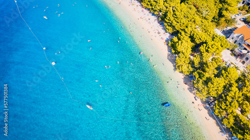 Take in the beauty of Croatia's coastal region from a new perspective with this stunning drone view, which features clear blue water and forested land.