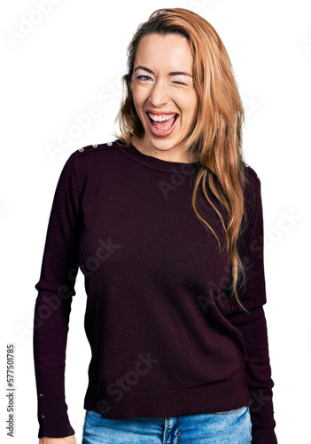 Young caucasian woman wearing casual clothes winking looking at the camera with sexy expression, cheerful and happy face.