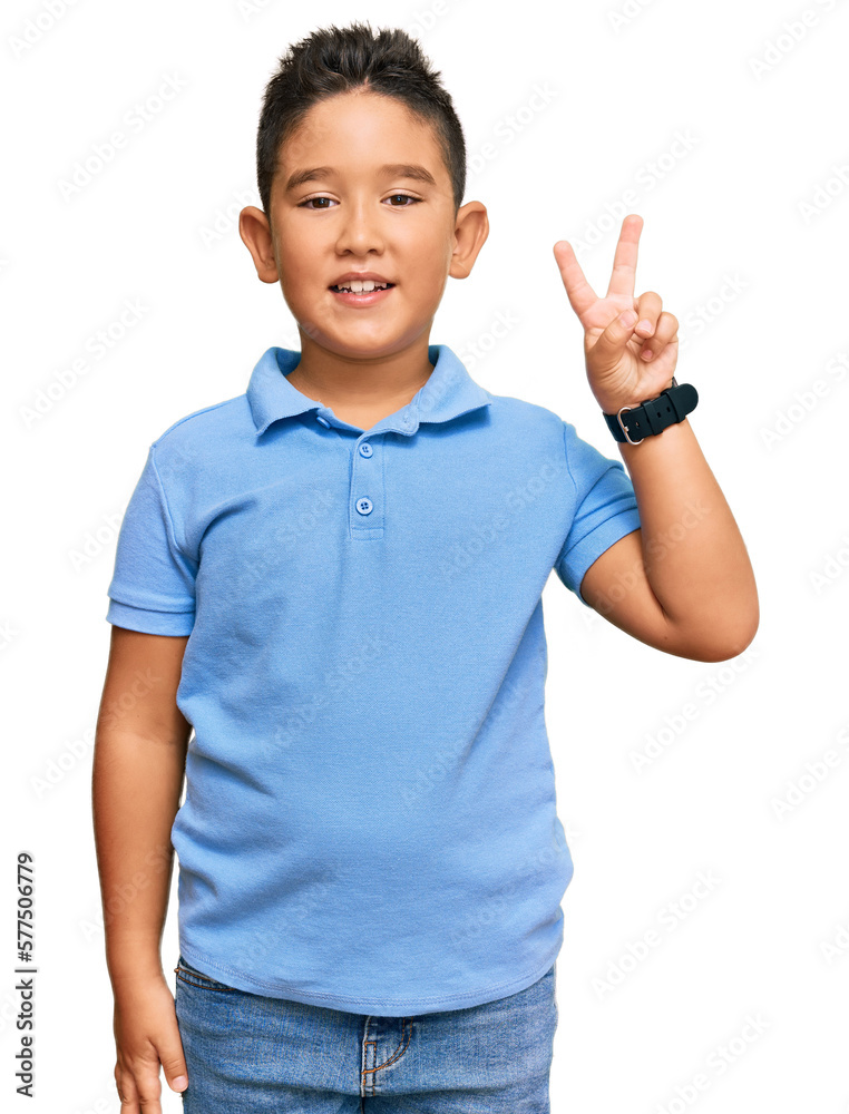 Little boy hispanic kid wearing casual clothes showing and pointing up with fingers number two while smiling confident and happy. Little boy hispanic kid wearing casual clothes showing and pointing up with fingers number two while smiling confident and happy.