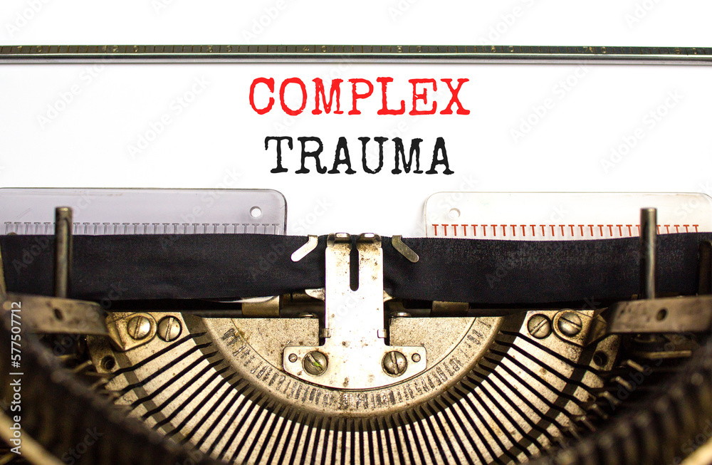 Complex trauma symbol. Concept words Complex trauma typed on white paper on old retro typewriter. Beautiful white background. Business psychology complex trauma concept. Copy space.