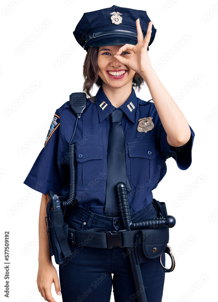 Young beautiful girl wearing police uniform doing ok gesture with hand smiling, eye looking through fingers with happy face. Young beautiful girl wearing police uniform doing ok gesture with hand smiling, eye looking through fingers with happy face.