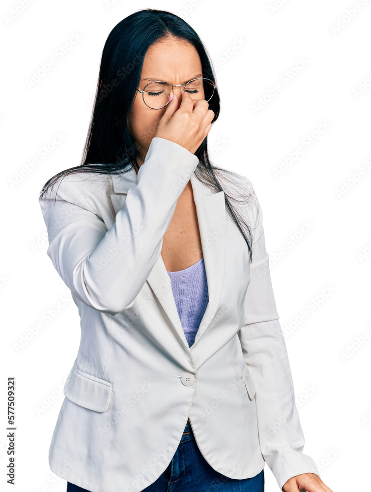 Beautiful hispanic woman with nose piercing wearing business jacket and glasses tired rubbing nose and eyes feeling fatigue and headache. stress and frustration concept. Beautiful hispanic woman with nose piercing wearing business jacket and glasses tired rubbing nose and eyes feeling fatigue and headache. stress and frustration concept.