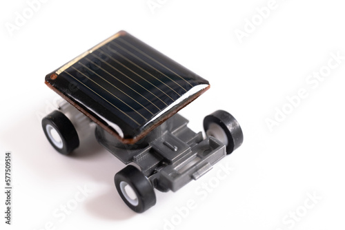 Solar powered toy car using small cells isolated on white background. Educational concept for solar powered cars, close up