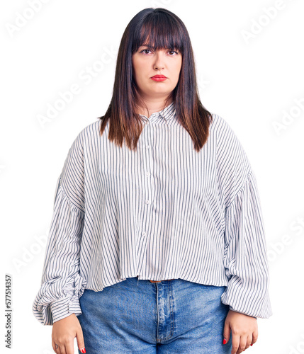 Canvas Print Young plus size woman wearing casual clothes skeptic and nervous, frowning upset because of problem