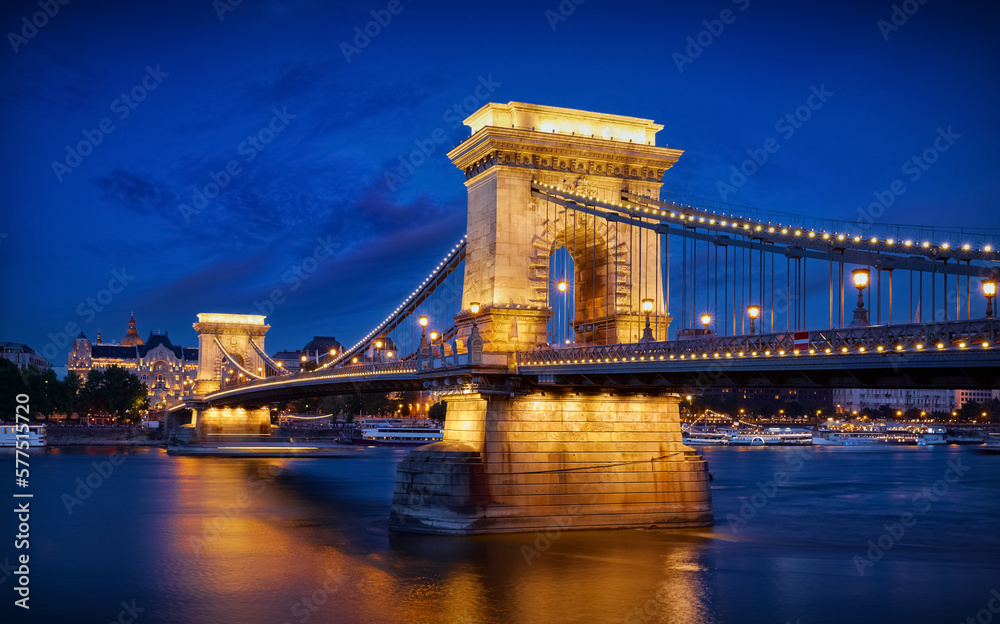 Obraz premium Budapest, Hungary. Chain bridge on Danube river in Budapest city with lanterns for nighttime backlighting and blue sky. Hour evening time