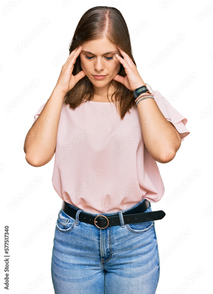 Beautiful caucasian woman wearing casual clothes with hand on head for pain in head because stress. suffering migraine.