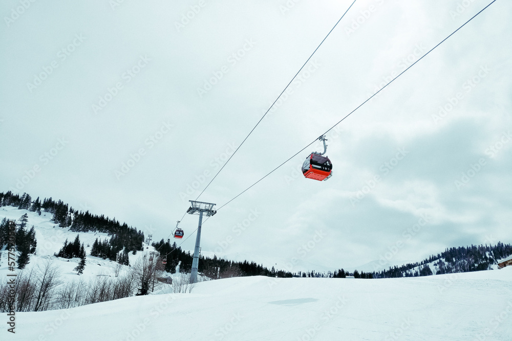 ski resort Goderdzi, Georgia. mountains are covered with snow. Red cable car above and mountains behind - Image ski resort Goderdzi, Georgia. mountains are covered with snow. Red cable car above and mountains behind - Image