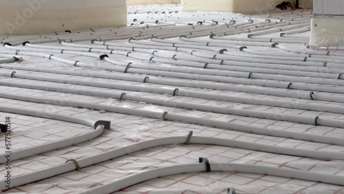 Installation of underfloor heating pipes for water heating. Heating systems. Pipes for underfloor heating