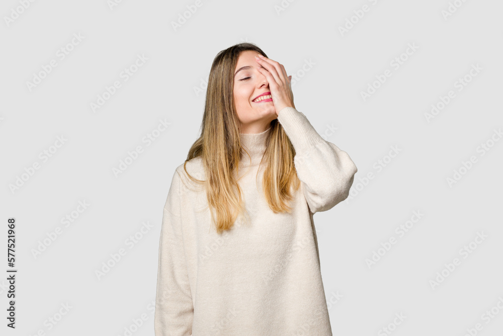 Young blonde posing for a portrait isolated, exuding natural beauty and radiance laughing happy, carefree, natural emotion. Young blonde posing for a portrait isolated, exuding natural beauty and radiance laughing happy, carefree, natural emotion.