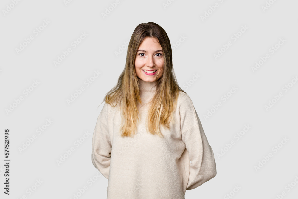 Young blonde posing for a portrait isolated, exuding natural beauty and radiance happy, smiling and cheerful. Young blonde posing for a portrait isolated, exuding natural beauty and radiance happy, smiling and cheerful.