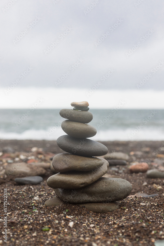 Sea pebbles tower closeup. Vertical banner photo Sea pebbles tower closeup. Vertical banner photo
