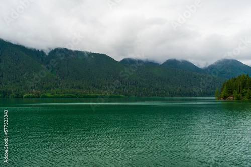 tranquil lake with clouds and fog