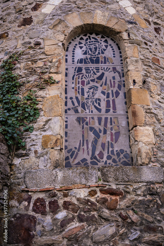 Exterior vertical stained glass window of church in Laval, France, Mayenne.