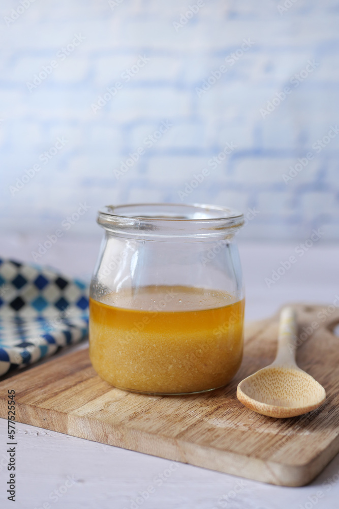 homemade ghee in container on a table , homemade ghee in container on a table ,