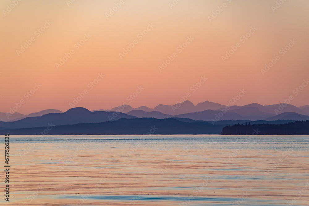 Beautiful Sunset With Purple Mountains on Strait of Georgia in Vancouver Island , British Columbia, Canada Beautiful Sunset With Purple Mountains on Strait of Georgia in Vancouver Island , British Columbia, Canada