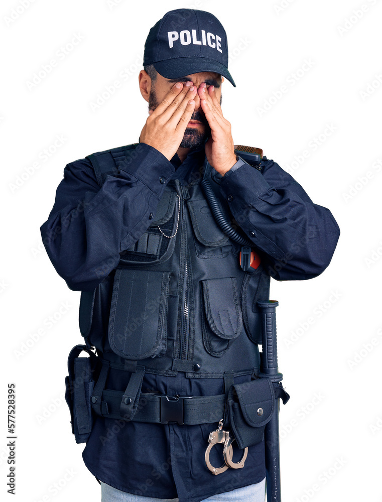 Young hispanic man wearing police uniform rubbing eyes for fatigue and headache, sleepy and tired expression. vision problem Young hispanic man wearing police uniform rubbing eyes for fatigue and headache, sleepy and tired expression. vision problem